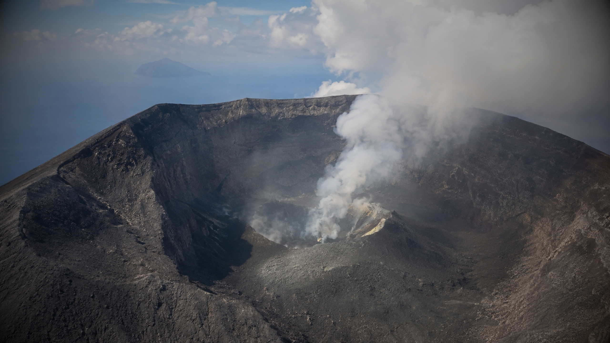 Dukono volcanic complex beneath an ash plume on Halmahera